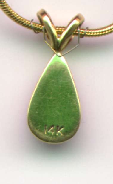 Back view of a necklace, pendant, and pendant positiioner at 10 times real size.